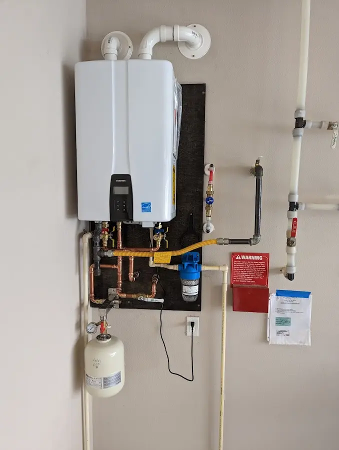 Professional plumber installing copper piping in a Tierra Verde home